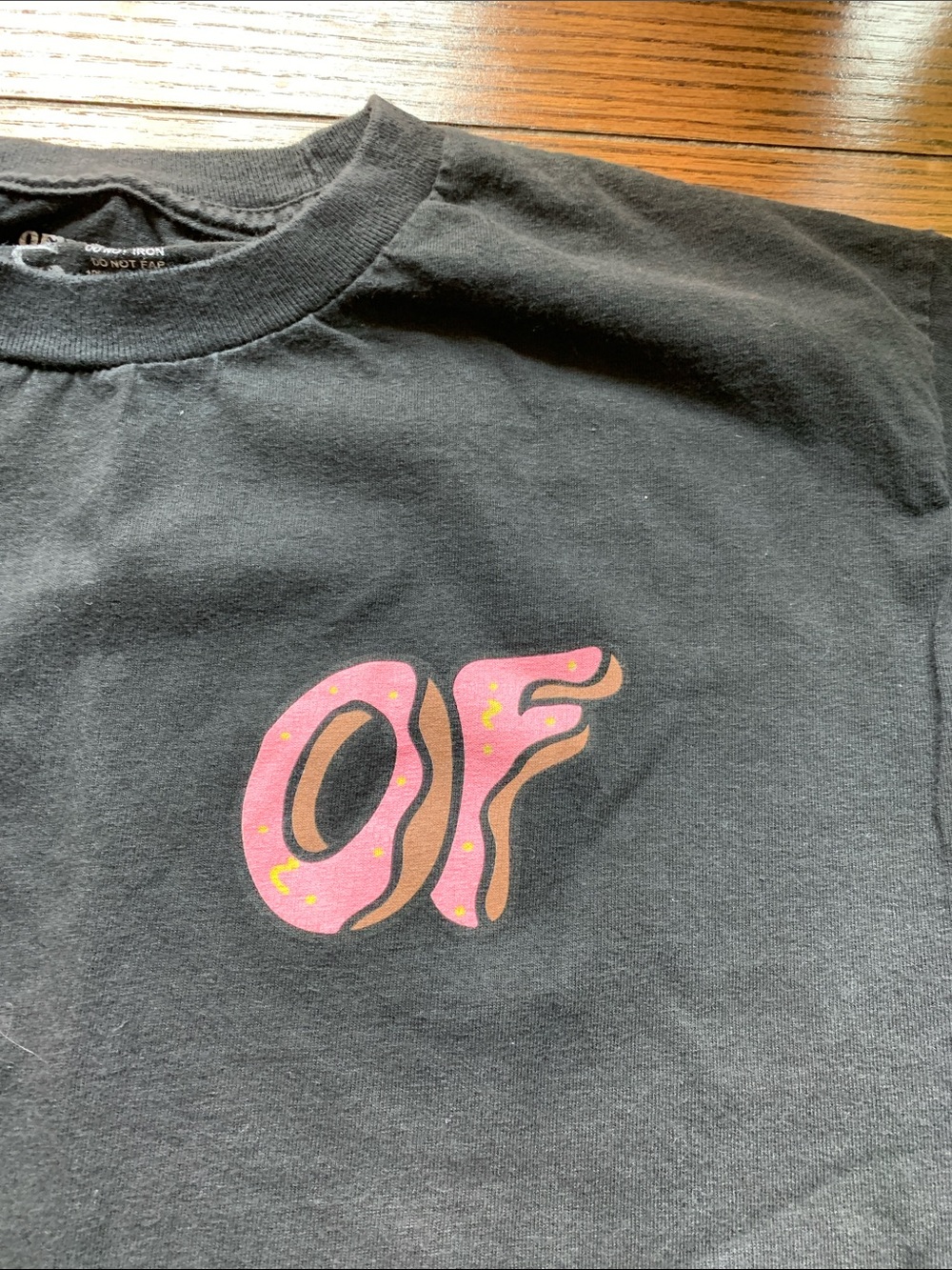 Black Short-Sleeve Tee with Pink 'OF' Graphic